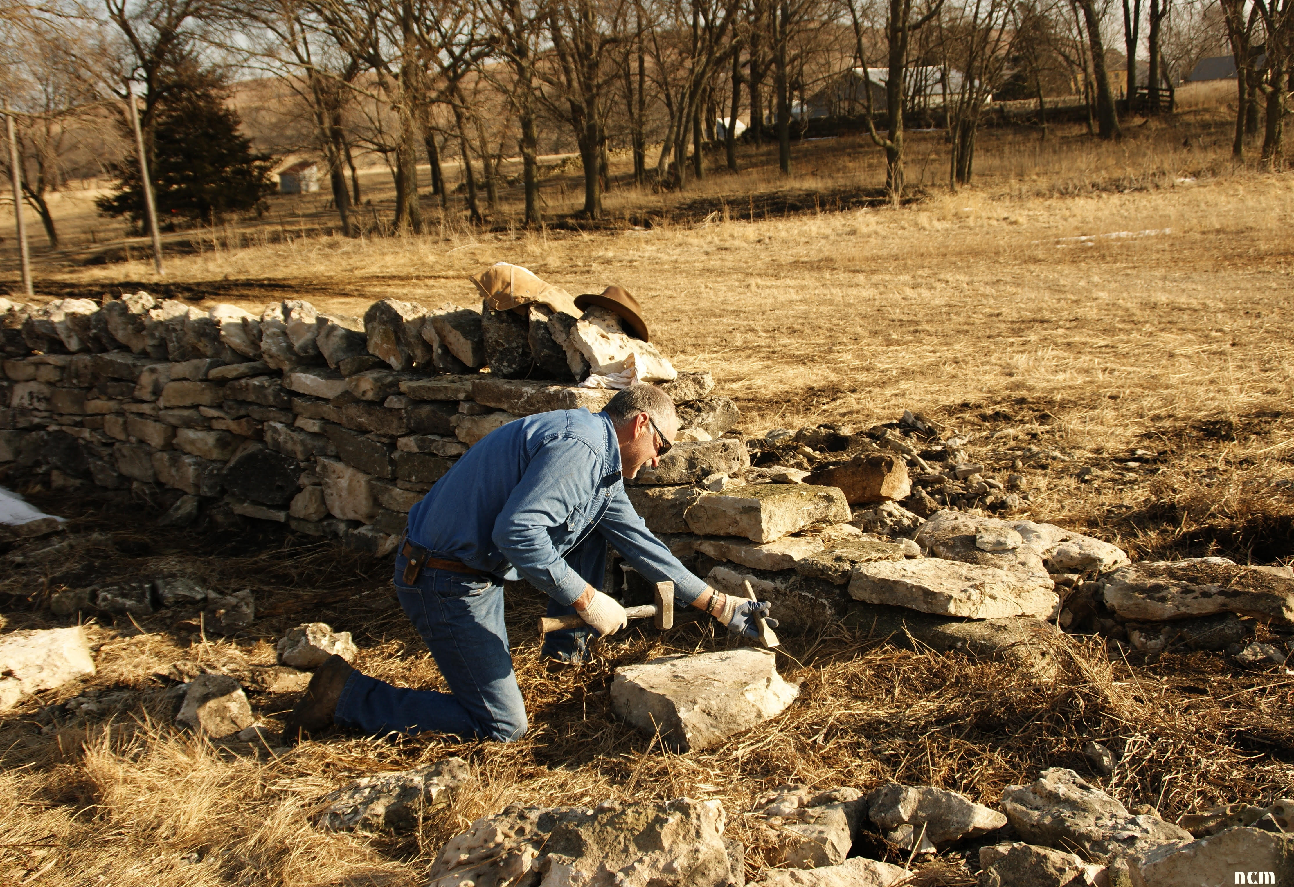 Restoration of an stone fence. Photo credit Nancy Crenshaw-Miller.